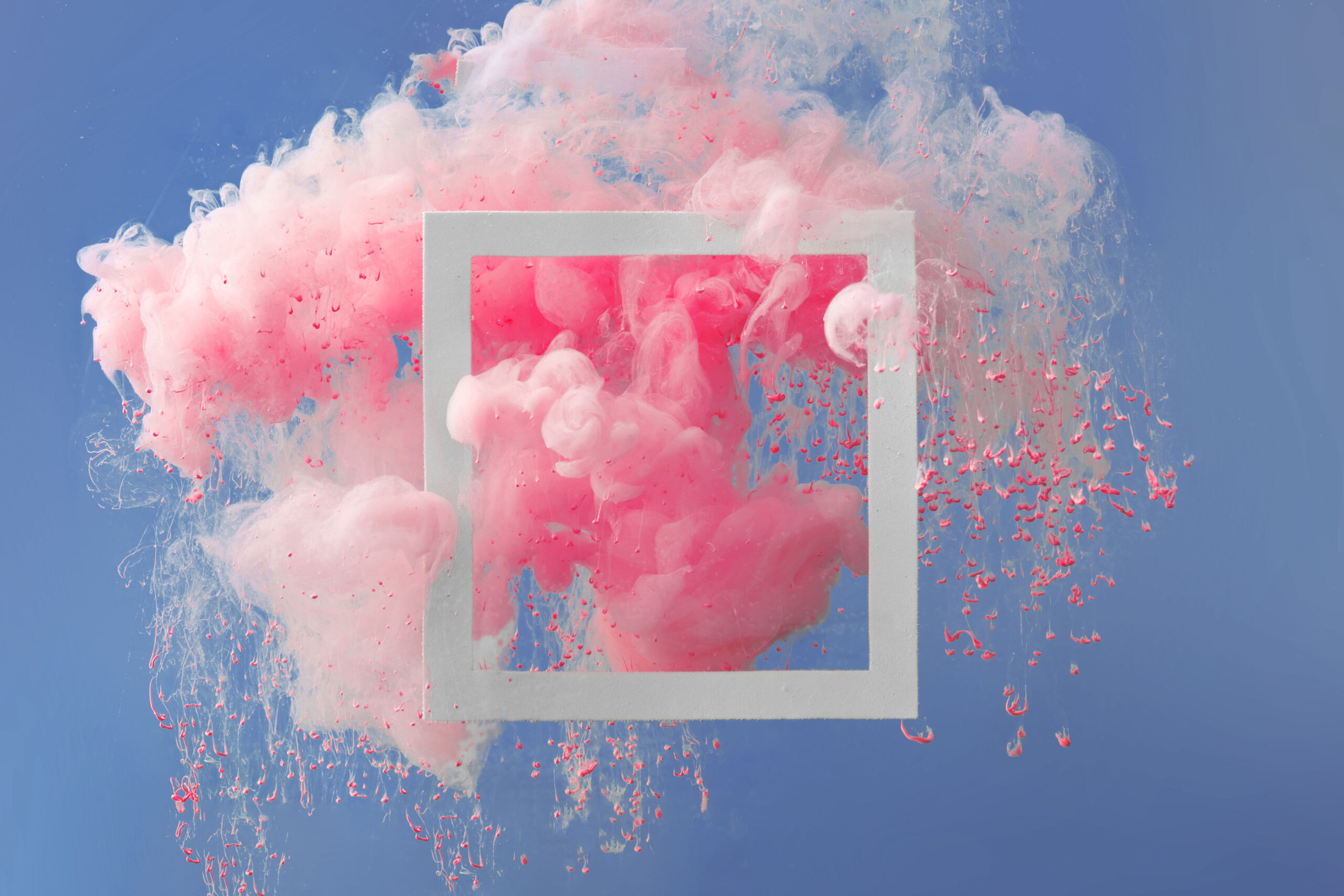 Image of a frame with an exploding powder inside, representing the creative process.