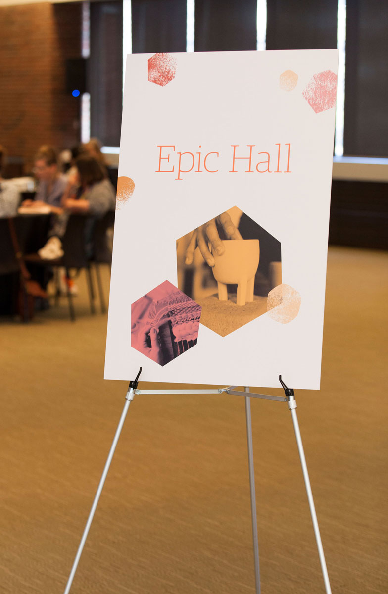 An easel with a poster with Etsy Captain's Summit branding. This room is named Epic Hall