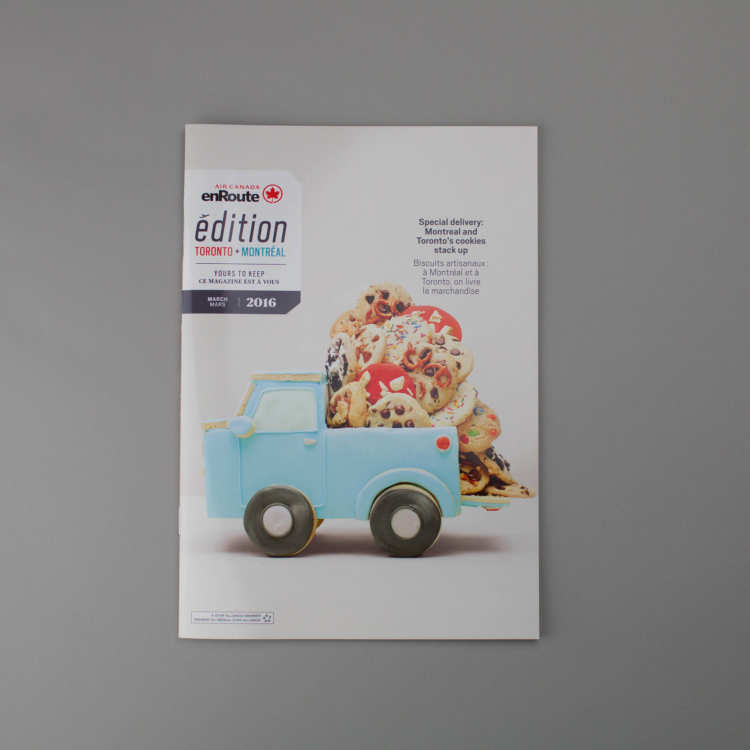A whimsical stack of ice cream on a cone, hovering above a open hand. Art directed by Jen Spinner.