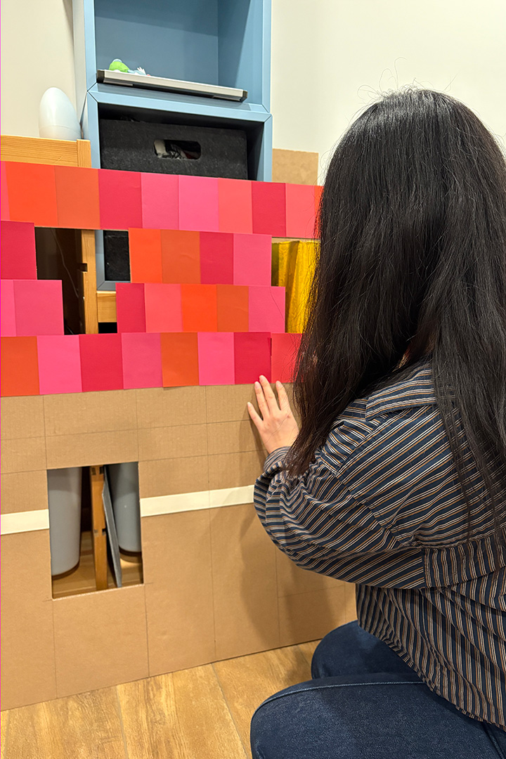 Behind the scenes of our paper house installation. Image by Jen Spinner